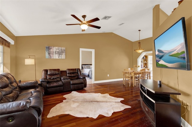 living room with lofted ceiling, ceiling fan, and dark wood-type flooring