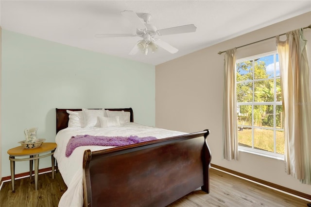 bedroom featuring ceiling fan and light hardwood / wood-style floors