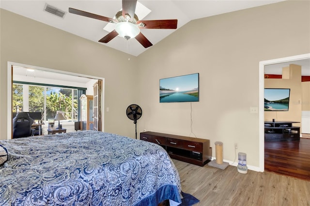 bedroom featuring light wood-type flooring, ceiling fan, and lofted ceiling