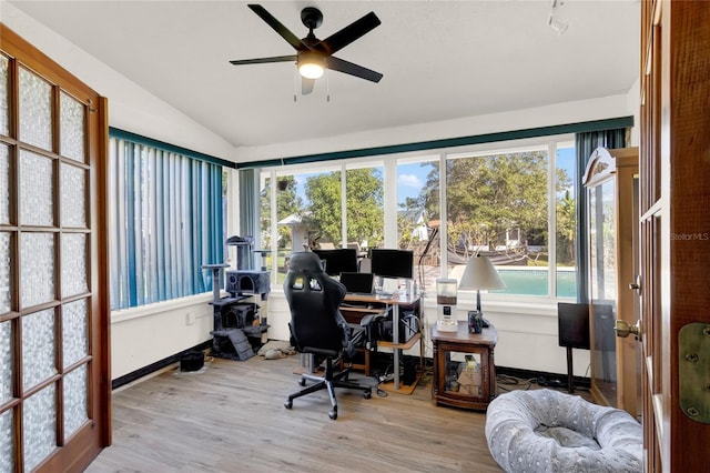 office featuring ceiling fan, light hardwood / wood-style floors, and lofted ceiling