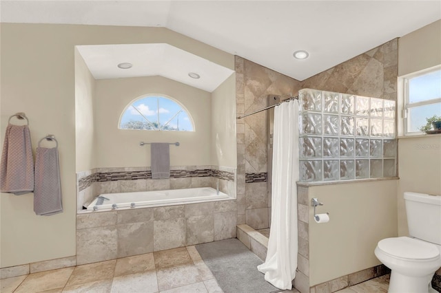 bathroom featuring shower with separate bathtub, toilet, and lofted ceiling