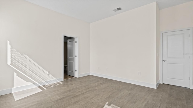 spare room featuring hardwood / wood-style floors