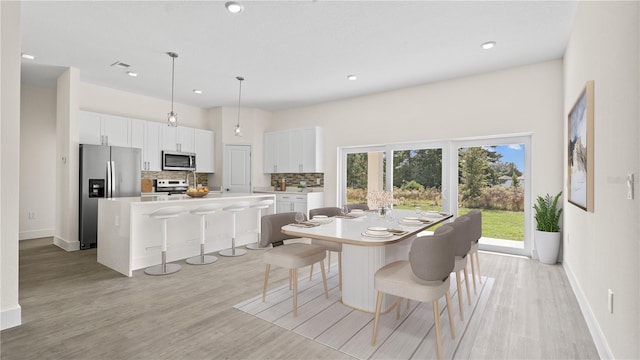 dining room featuring light wood-type flooring