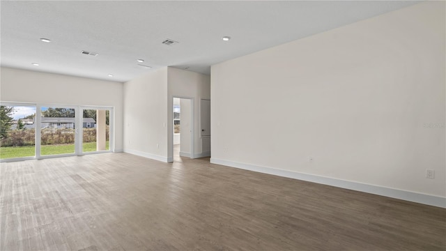 empty room with dark wood-type flooring