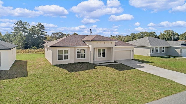 view of front of home featuring a garage and a front yard