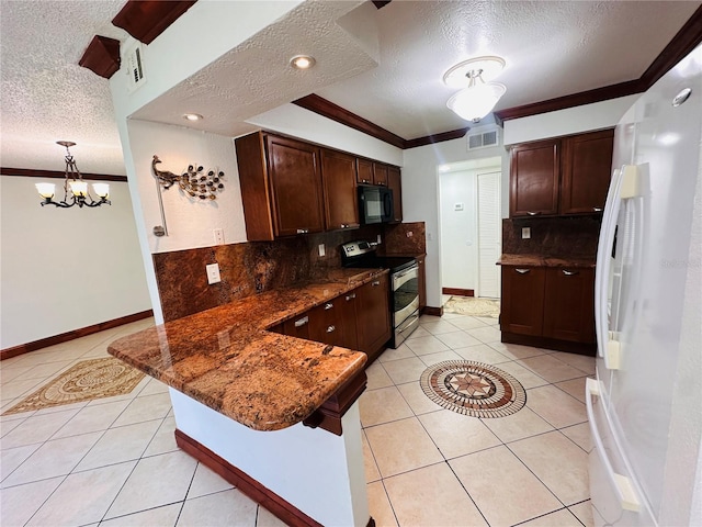 kitchen featuring stainless steel range with electric stovetop, a textured ceiling, backsplash, and white fridge