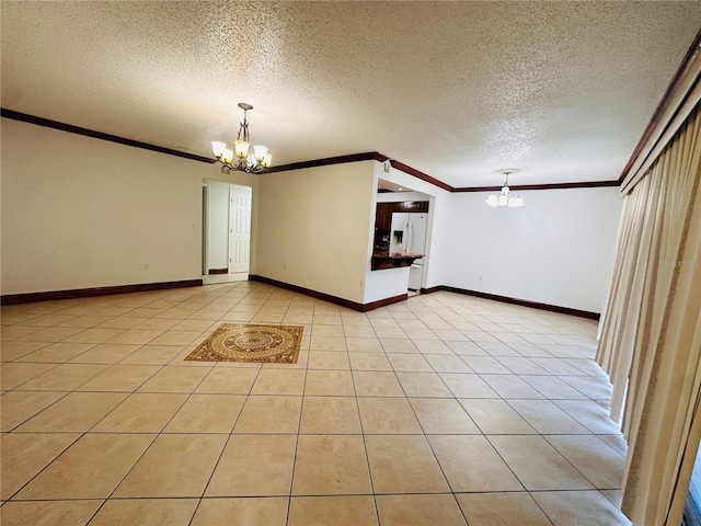 tiled spare room featuring a notable chandelier, a textured ceiling, and crown molding