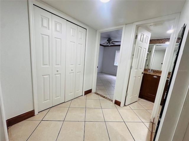 corridor featuring light tile patterned floors