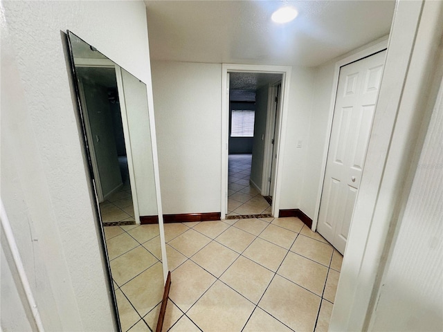 corridor with light tile patterned floors