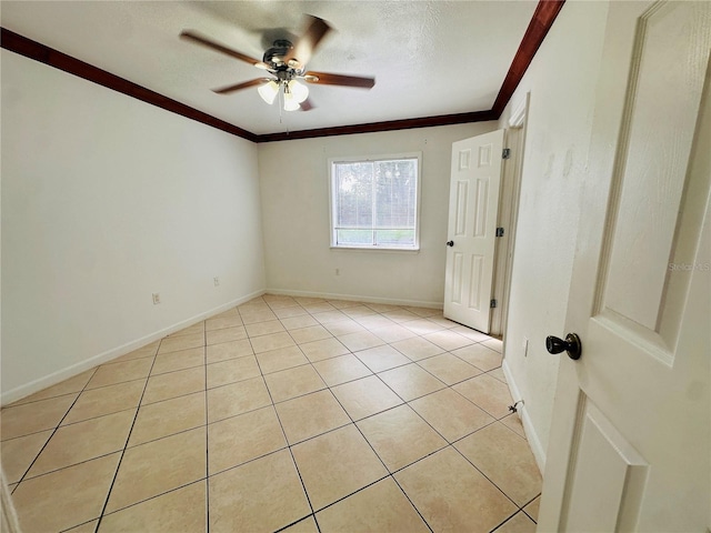 tiled spare room with ornamental molding, a textured ceiling, and ceiling fan