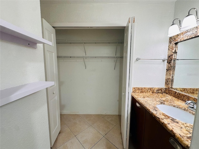 bathroom with vanity and tile patterned flooring