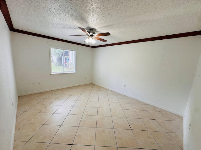 spare room featuring light tile patterned flooring, ceiling fan, a textured ceiling, and ornamental molding