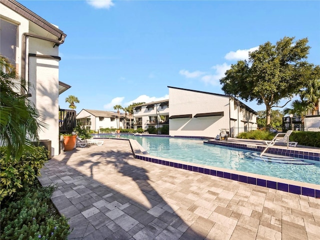 view of pool featuring a patio