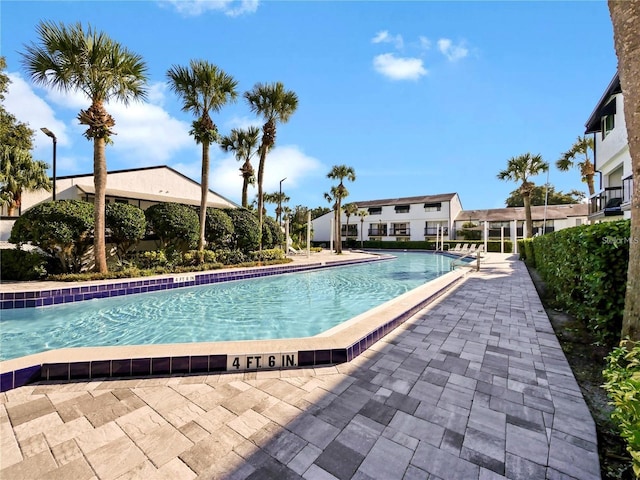 view of swimming pool featuring a patio area