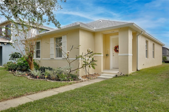 view of front of home with a front yard