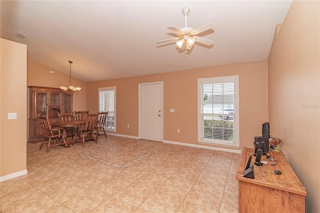 interior space featuring ceiling fan with notable chandelier and vaulted ceiling