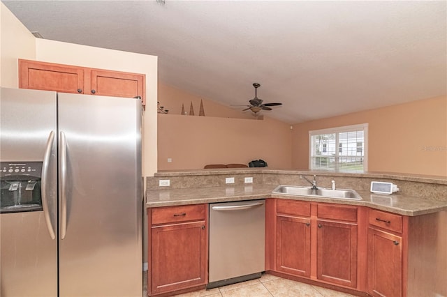 kitchen with stainless steel appliances, light tile patterned floors, sink, vaulted ceiling, and ceiling fan