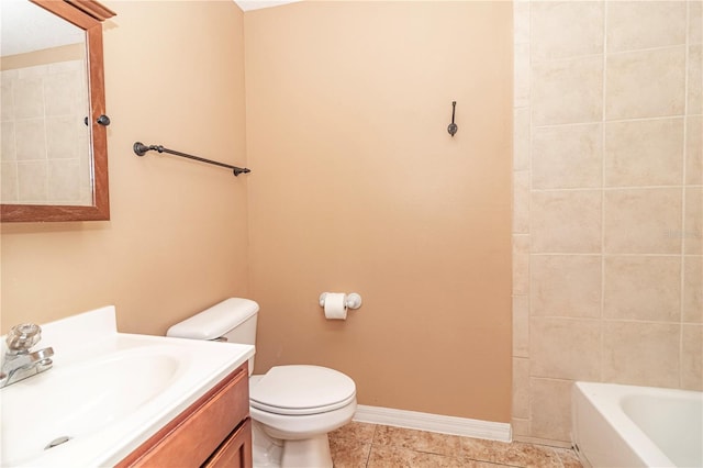 bathroom featuring tile patterned floors, vanity, and toilet