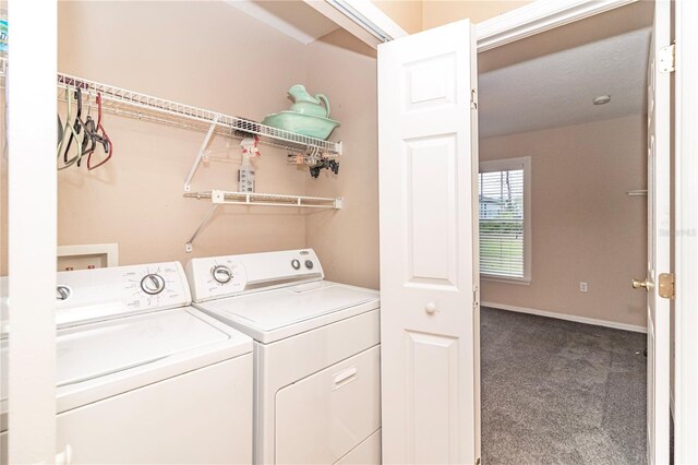 clothes washing area featuring carpet flooring and independent washer and dryer