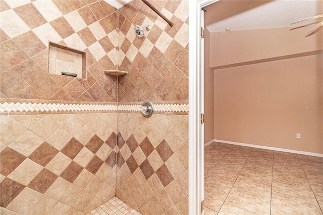 bathroom with tile patterned flooring and tiled shower