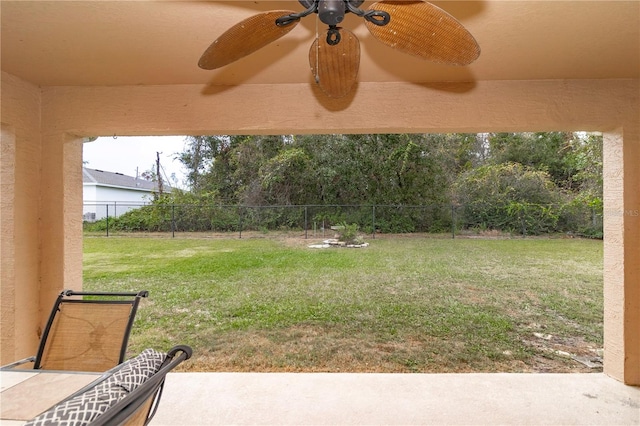 view of yard with ceiling fan