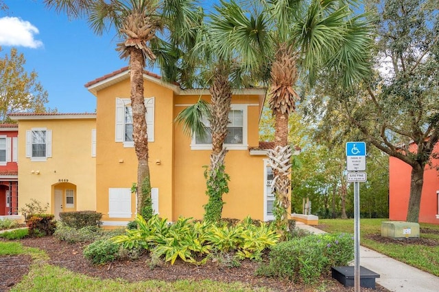8447 Crystal Cove Loop, Kissimmee, FL 34747 - view of front of home featuring stucco siding