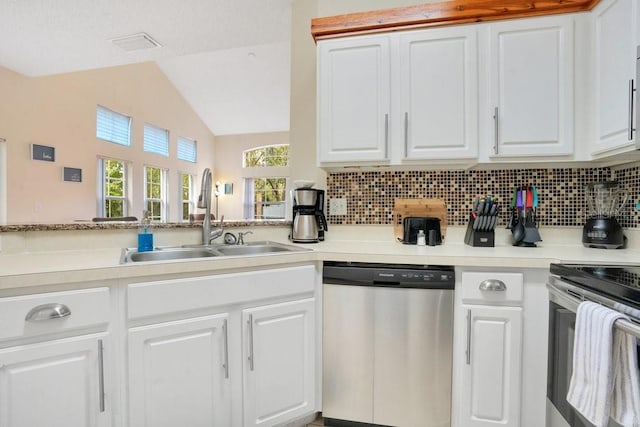 kitchen with white cabinetry, sink, backsplash, and appliances with stainless steel finishes