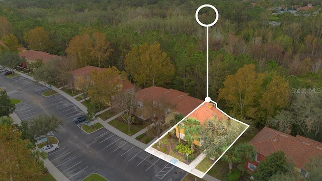 8447 Crystal Cove Loop, Kissimmee, FL 34747 - aerial view of property and surrounding area with a heavily wooded area and property boundaries highlighted