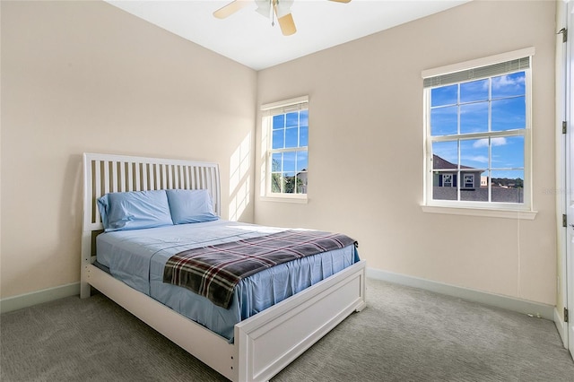 bedroom featuring ceiling fan and carpet