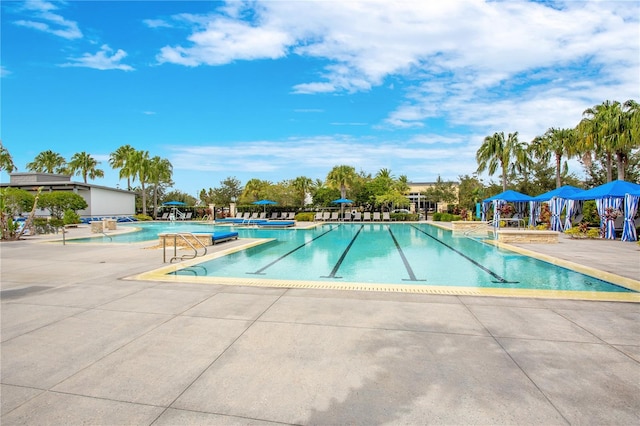 view of swimming pool featuring a patio area