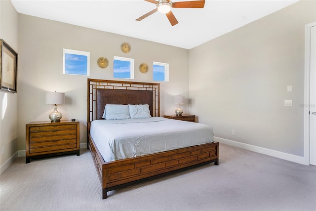 bedroom with light carpet and ceiling fan