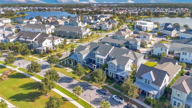 birds eye view of property featuring a water view