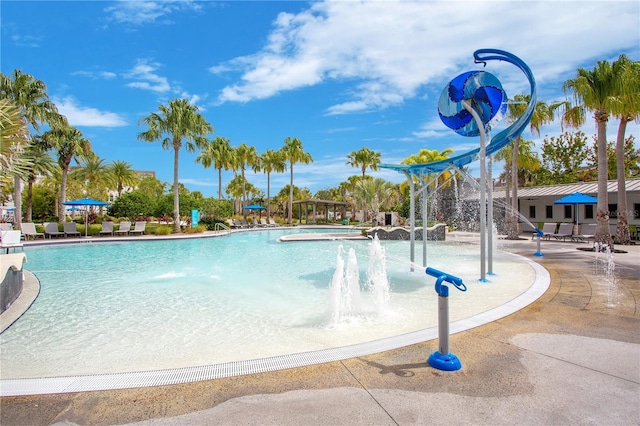 view of pool with pool water feature