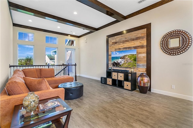 living room featuring hardwood / wood-style floors and beamed ceiling