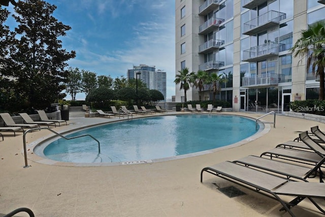 view of swimming pool featuring a patio area