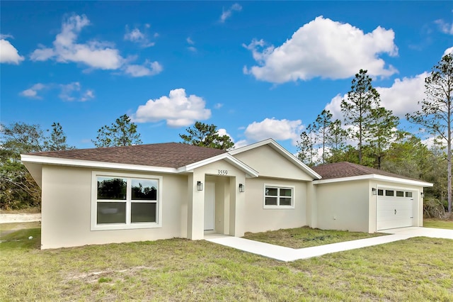 ranch-style house featuring a front yard and a garage