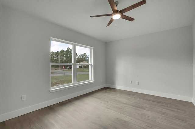 unfurnished room featuring wood-type flooring and ceiling fan