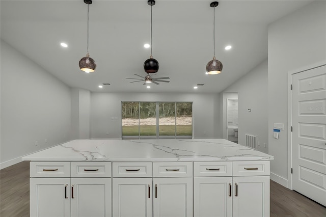 kitchen featuring ceiling fan, a center island, white cabinets, and wood-type flooring