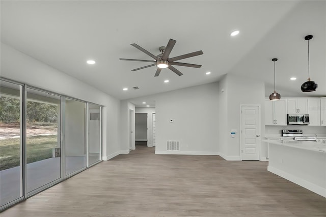 unfurnished living room with ceiling fan, high vaulted ceiling, and light hardwood / wood-style floors