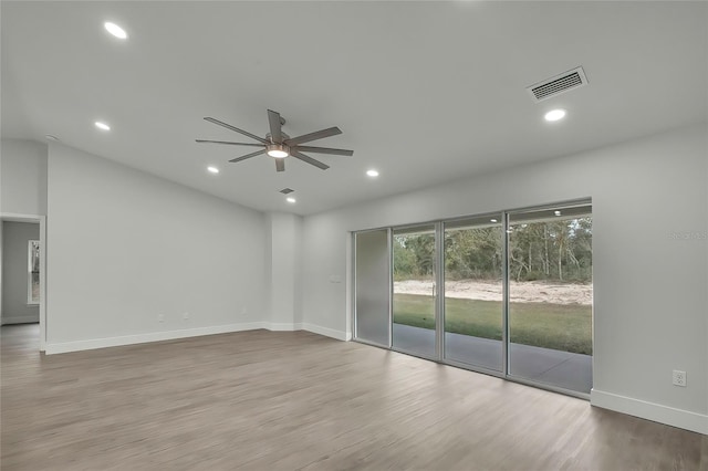 spare room featuring light wood-type flooring and ceiling fan