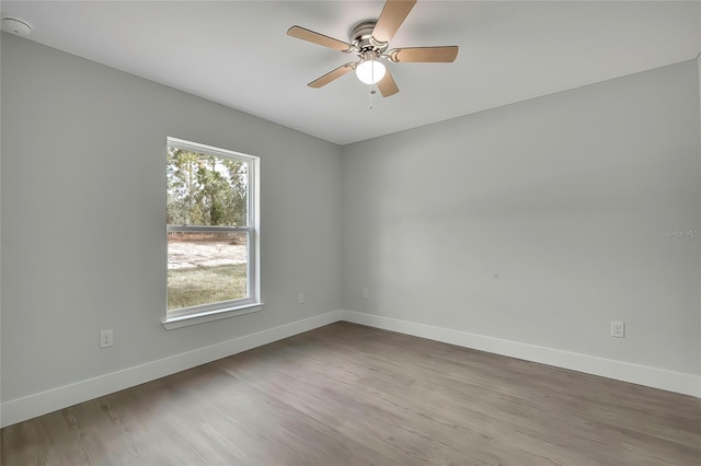 unfurnished room featuring ceiling fan and wood-type flooring