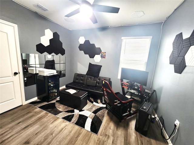 office space with dark hardwood / wood-style floors and ceiling fan