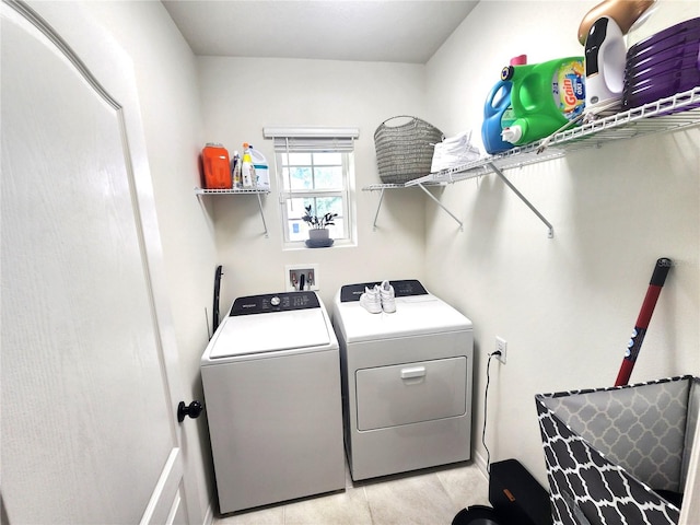 laundry room with washing machine and clothes dryer