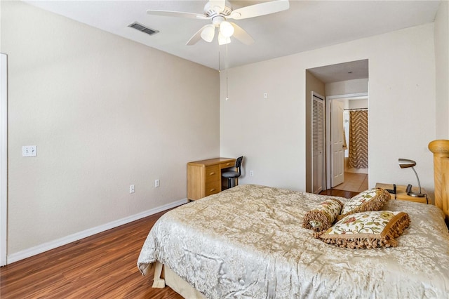 bedroom featuring wood-type flooring, a closet, and ceiling fan