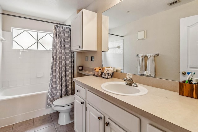 full bathroom featuring tile patterned flooring, shower / bath combo, vanity, and toilet