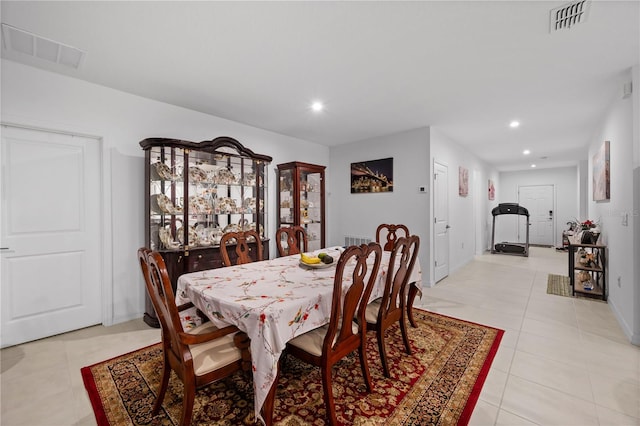 dining area with light tile patterned floors