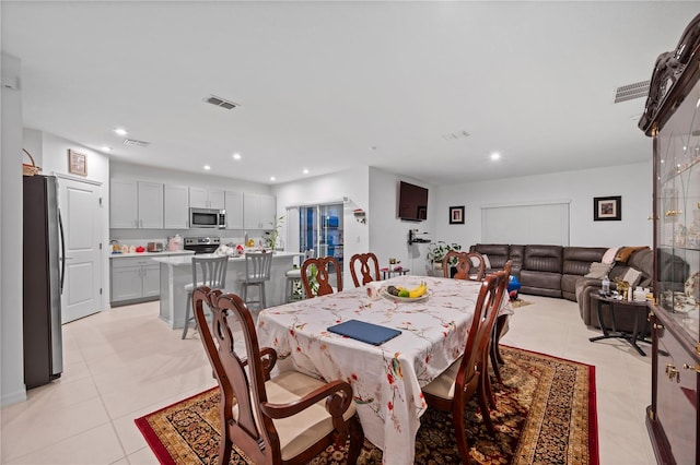 dining area with light tile patterned flooring