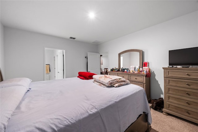 bedroom with light colored carpet