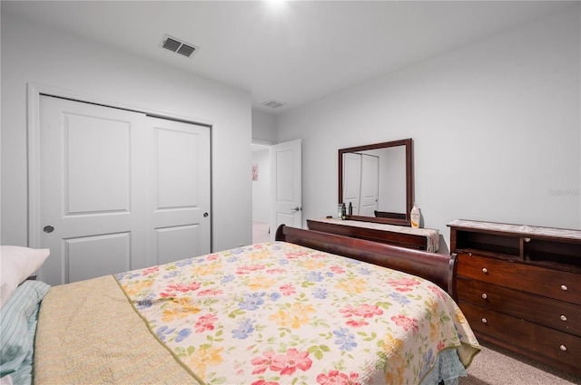 carpeted bedroom with a closet