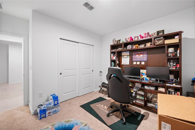 office area featuring light carpet